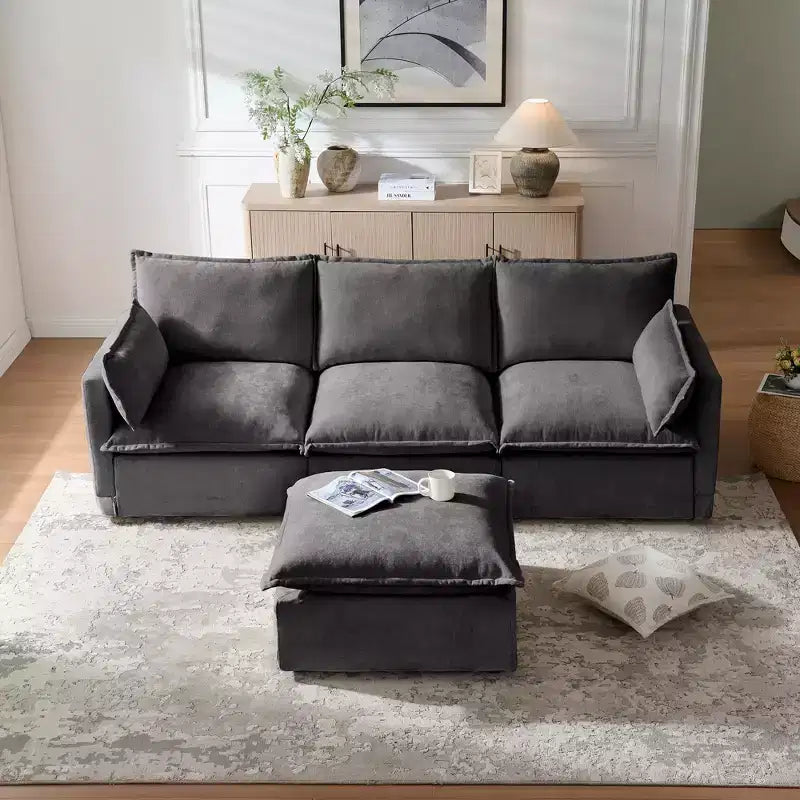 Divano a 4 posti a L moderno GDFStudio Sewell in simil lino con pouf mobile
