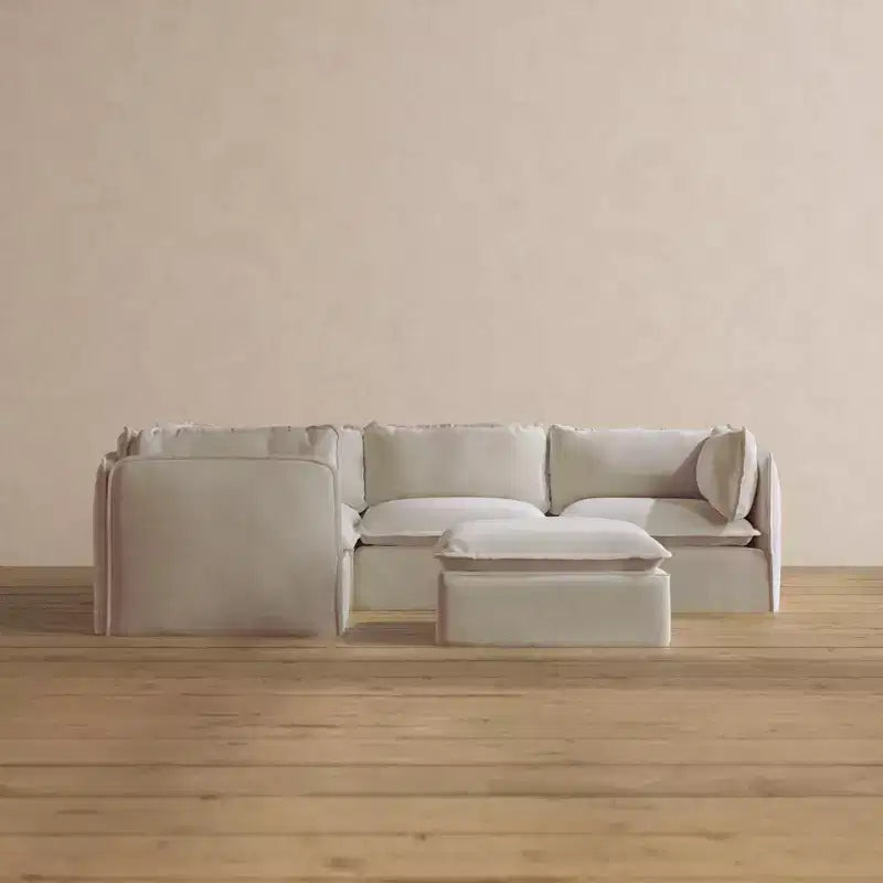 Divano angolare componibile lavabile Anabei, 4 posti, con pouf | Seduta Deluxe+ e cuscino Cloud