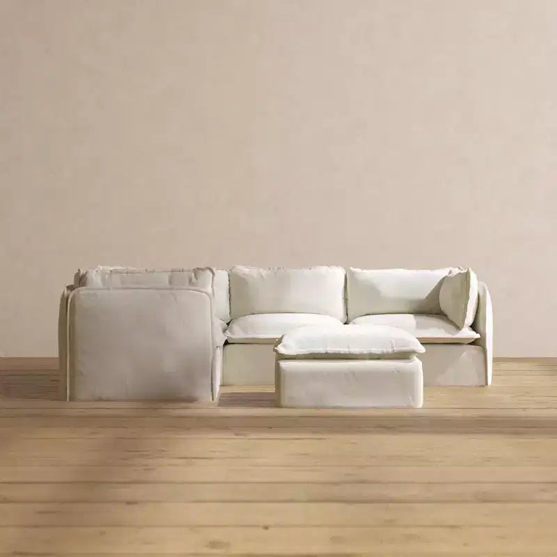 Divano angolare componibile lavabile Anabei, 4 posti, con pouf | Seduta Deluxe+ e cuscino Cloud