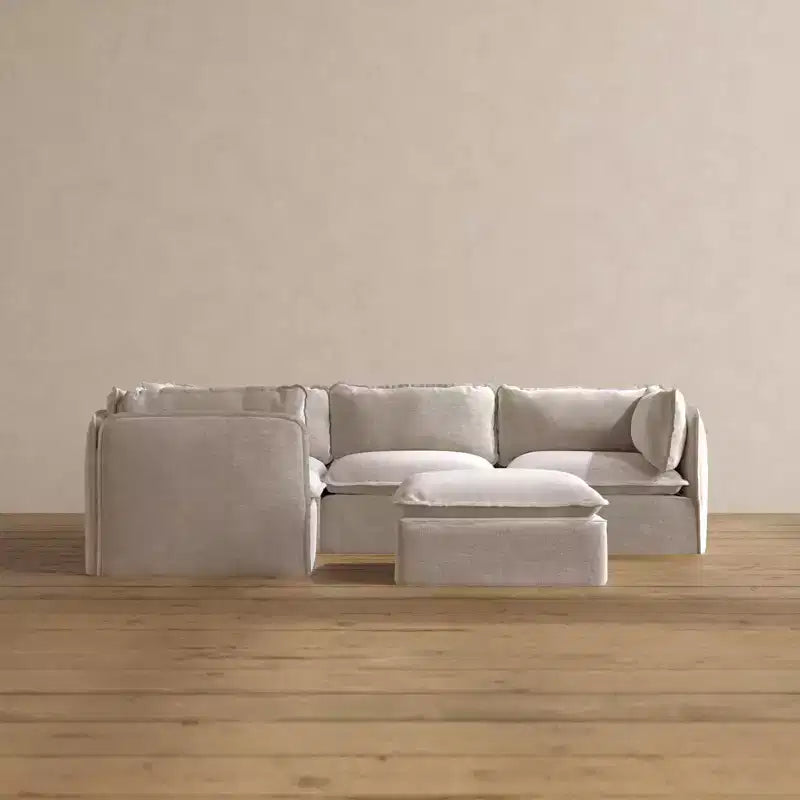 Divano angolare componibile lavabile Anabei, 4 posti, con pouf | Seduta Deluxe+ e cuscino Cloud