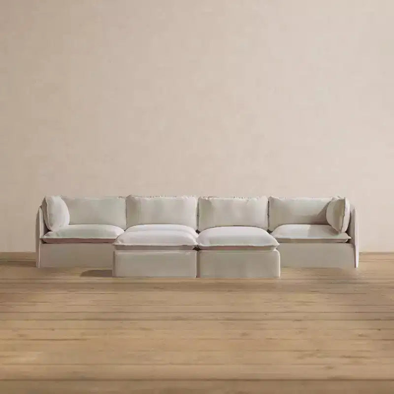 Divano componibile Anabei lavabile, 4 posti + pouf a panca | seduta Deluxe+ e cuscino cloud