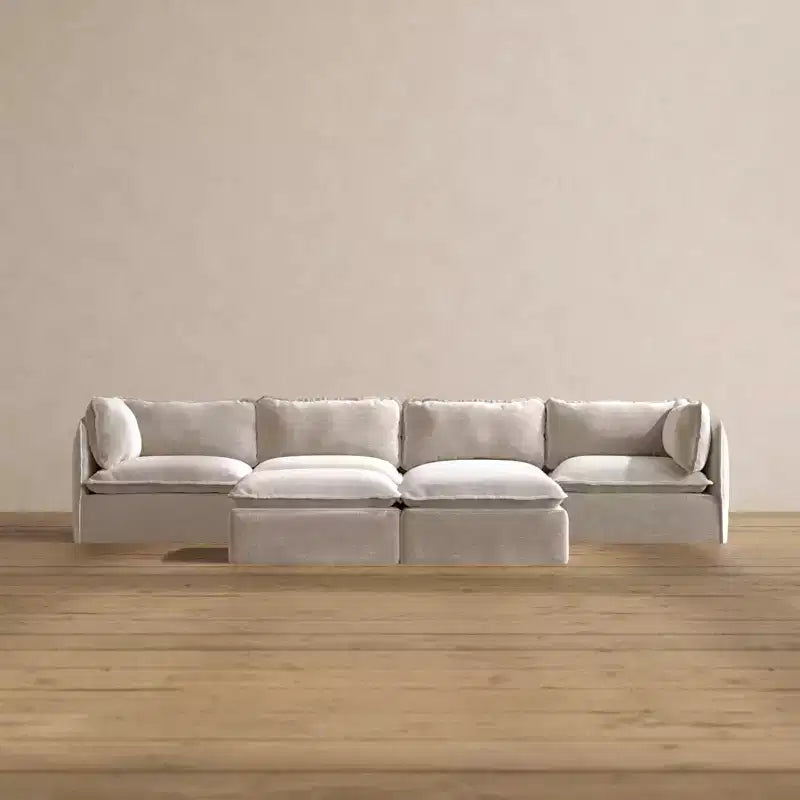 Divano componibile Anabei lavabile, 4 posti + pouf a panca | seduta Deluxe+ e cuscino cloud