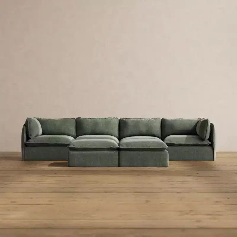 Divano componibile Anabei lavabile, 4 posti + pouf a panca | seduta Deluxe+ e cuscino cloud