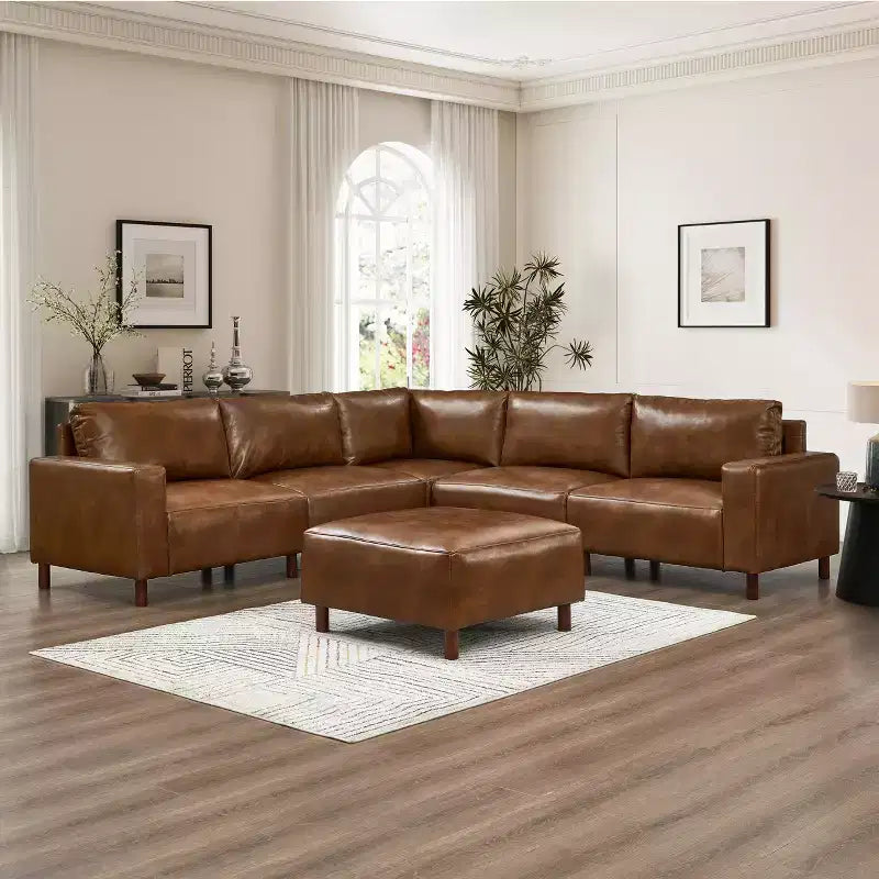 Divano componibile moderno a 5 posti GDFStudio Darcy 104 in similpelle con poggiapiedi