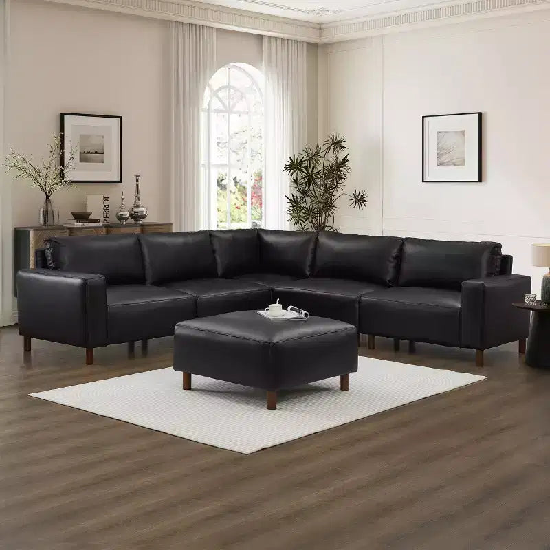 Divano componibile moderno a 5 posti GDFStudio Darcy 104 in similpelle con poggiapiedi