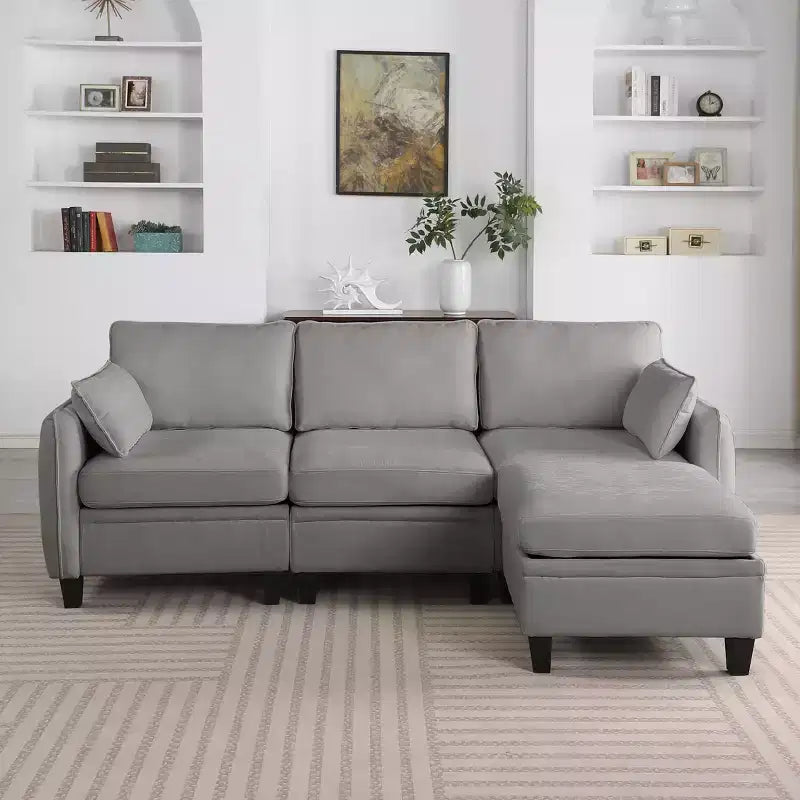 Sofá seccional em L estofado em chenille contemporâneo GDFStudio Lancelot de 85 polegadas, com pufe de arrumação