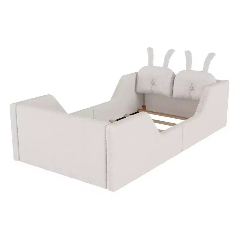 Letto a piattaforma singolo Whisen, struttura imbottita per letto a terra per bambini con cuscino a forma di coniglio e sponde laterali rimovibili