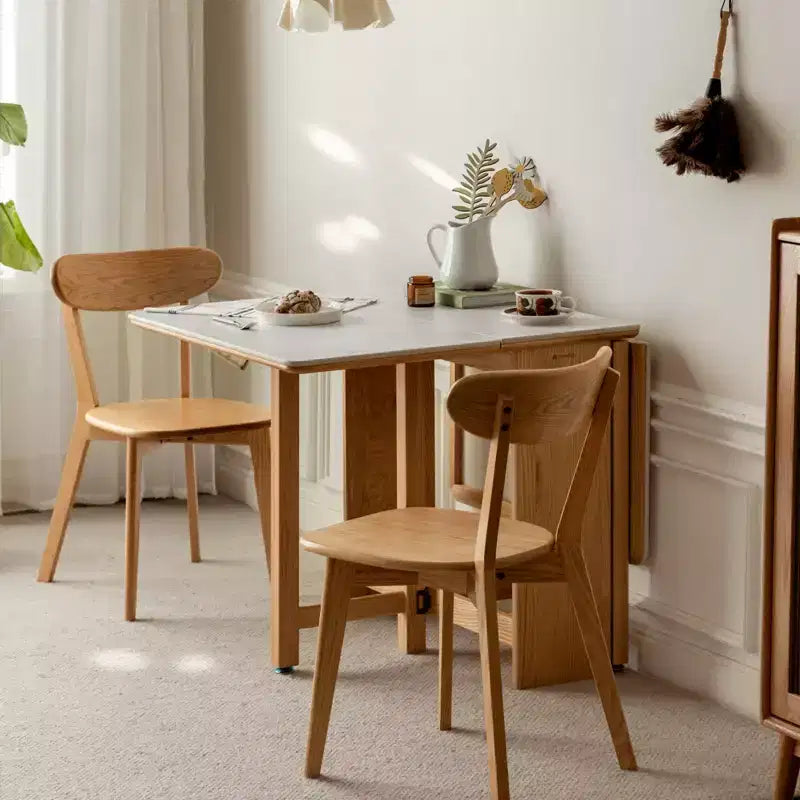 Tavolo pieghevole moderno GDFStudio Agatha in legno massello per 4-6 persone con piano effetto lastra di pietra