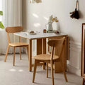 Tavolo pieghevole moderno GDFStudio Agatha in legno massello per 4-6 persone con piano effetto lastra di pietra