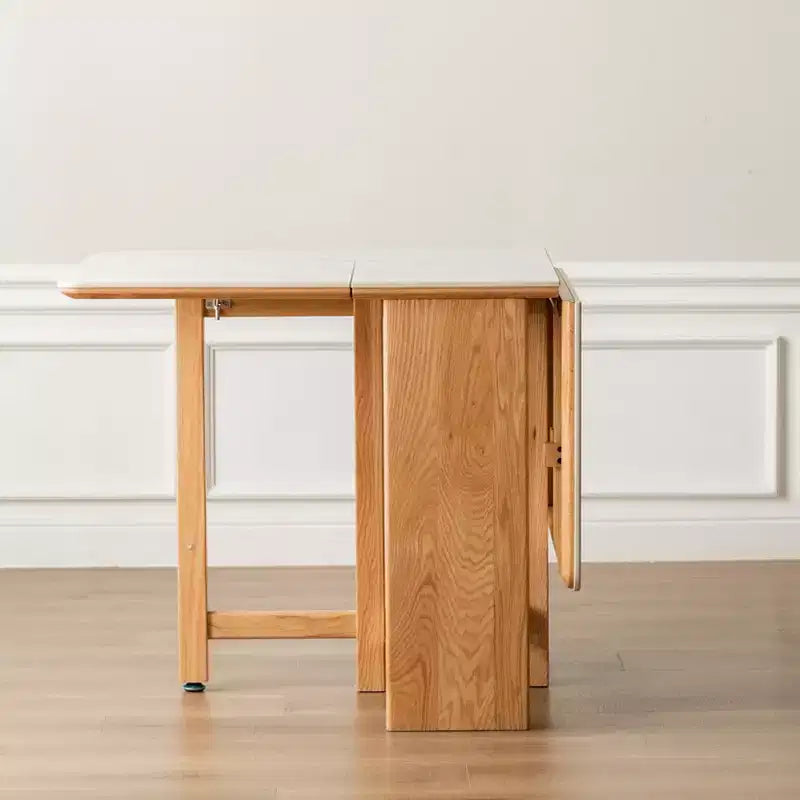Tavolo pieghevole moderno GDFStudio Agatha in legno massello per 4-6 persone con piano effetto lastra di pietra