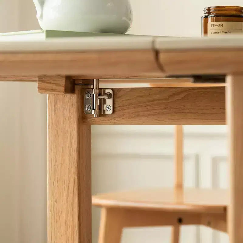 Tavolo pieghevole moderno GDFStudio Agatha in legno massello per 4-6 persone con piano effetto lastra di pietra