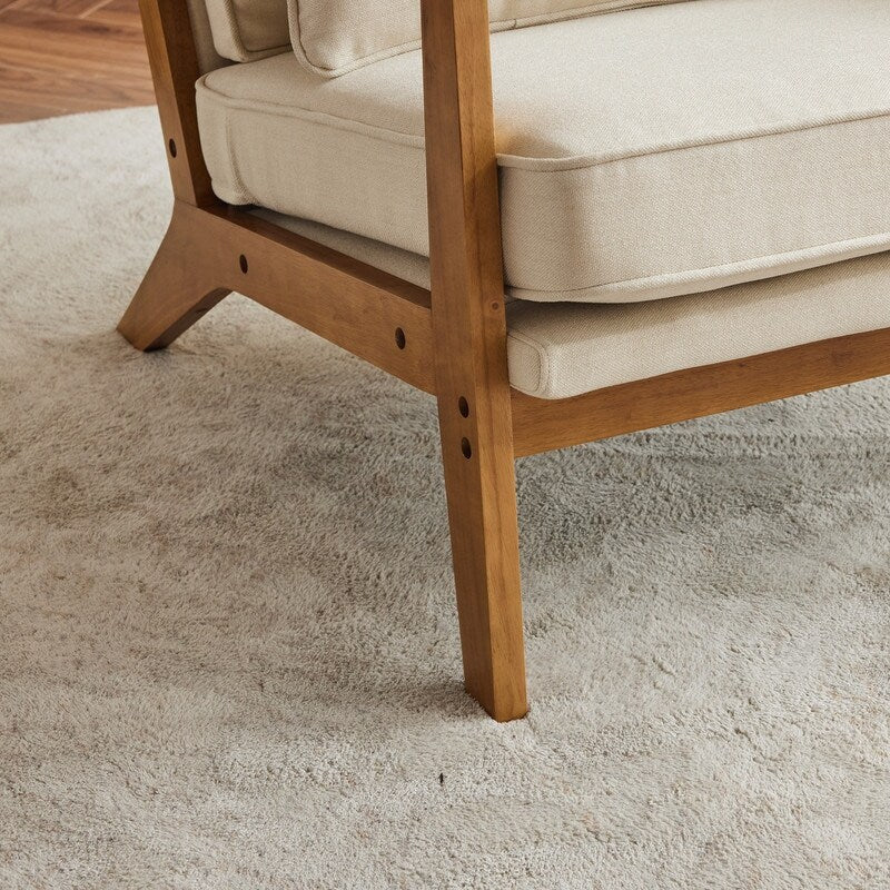 Poltrona d’accento imbottita in misto lino con gambe in legno e un cuscino, beige