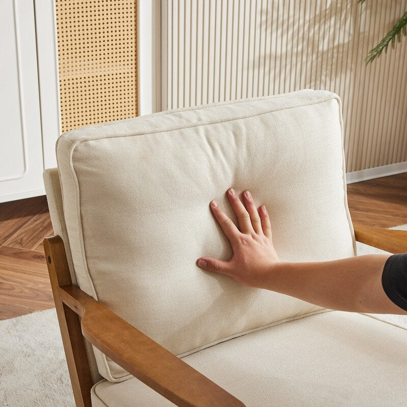 Poltrona d’accento imbottita in misto lino con gambe in legno e un cuscino, beige